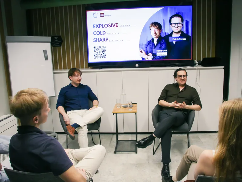 Moderator Marko Grad and guest Patrik Trobec in conversation on the stage at Impact Hub Ljubljana